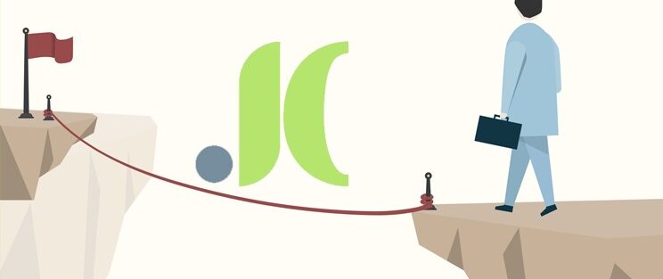 Imagen que muestra a un empresario a punto de cruzar por una cuerda entre dos acantilados