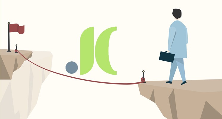 Imagen que muestra a un empresario a punto de cruzar por una cuerda entre dos acantilados